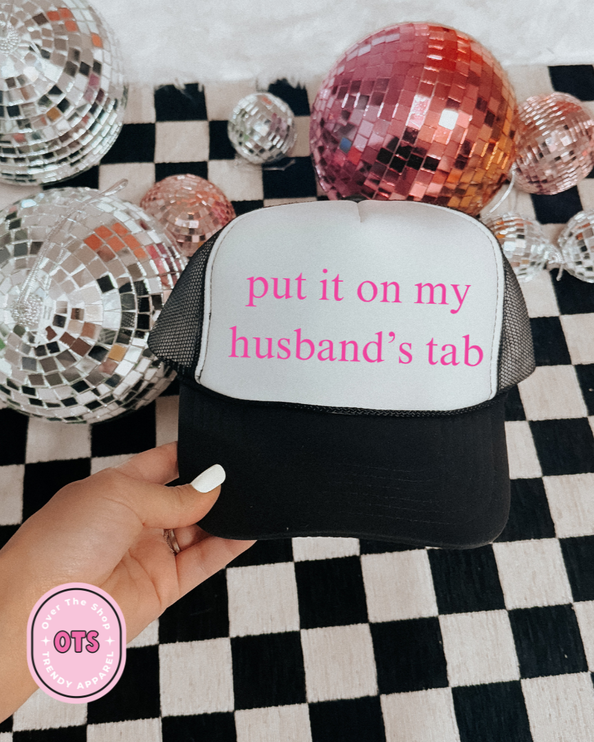 Put It On My Husbands Tab Trucker Hat
